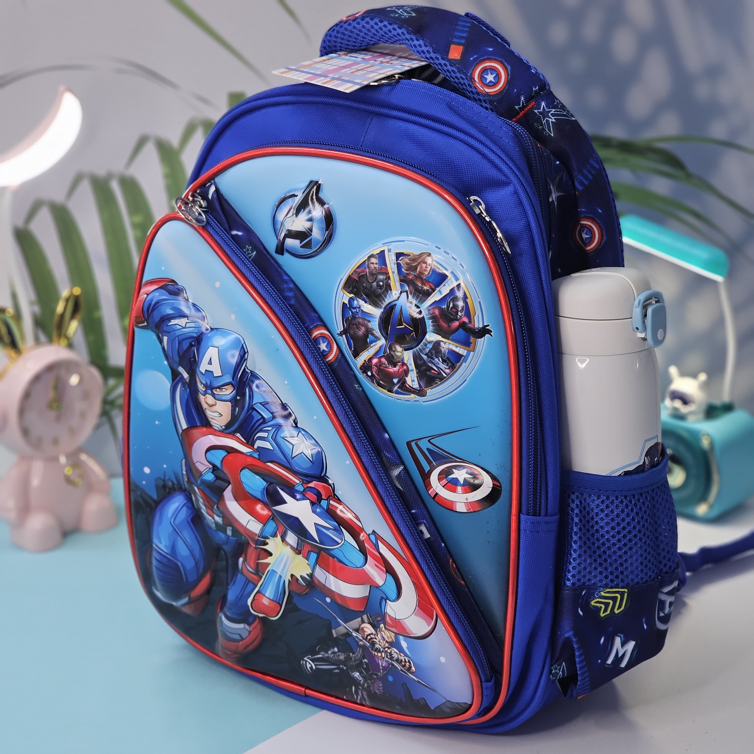 "Stylish and practical Usmile Toys backpack for boys, adorned with popular cartoon superhero characters, including Iron Man and Thor." www.usmile.toys
